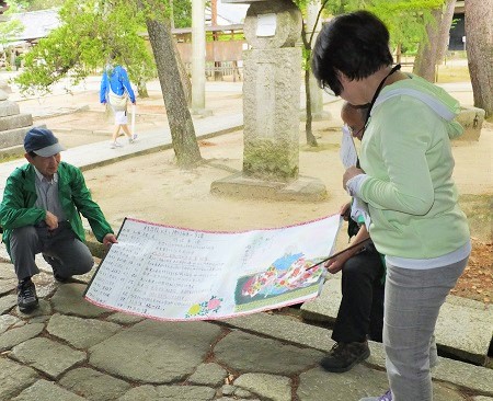 西田会員は自筆の絵画でお玉さんを解説